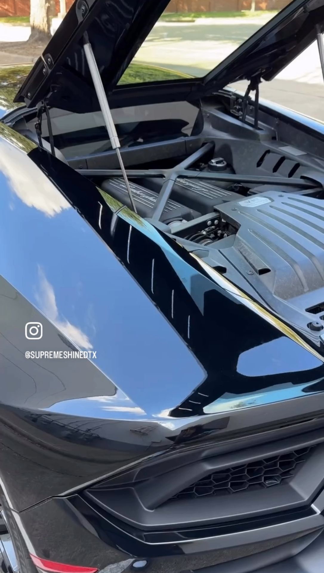 Black Lamborghini Huracán engine bay after detail